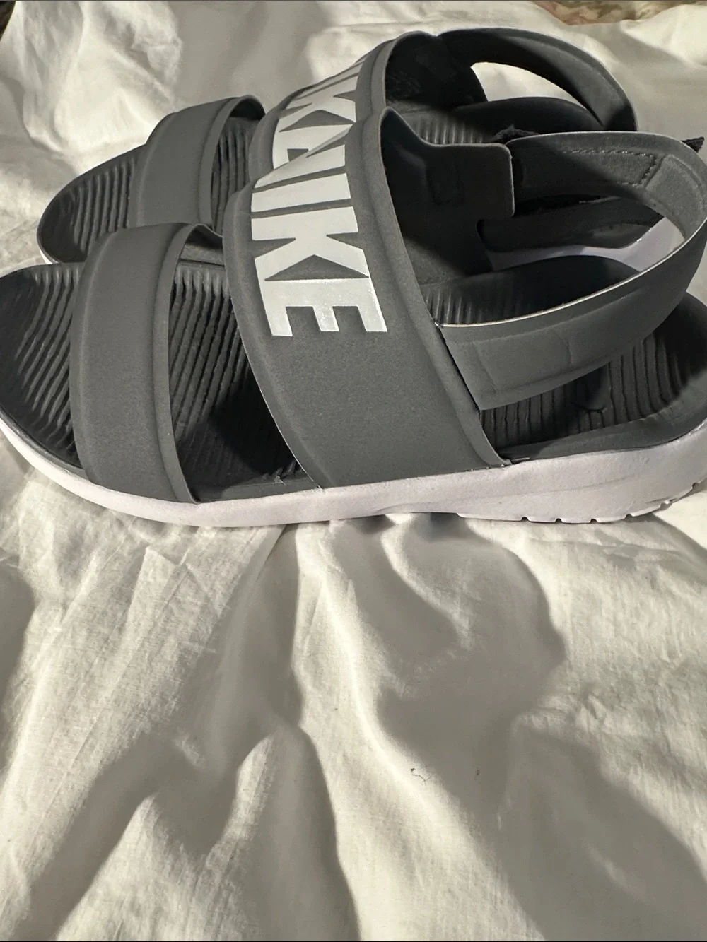 Nike Gray and White Slide Sandals with Subtle Branding